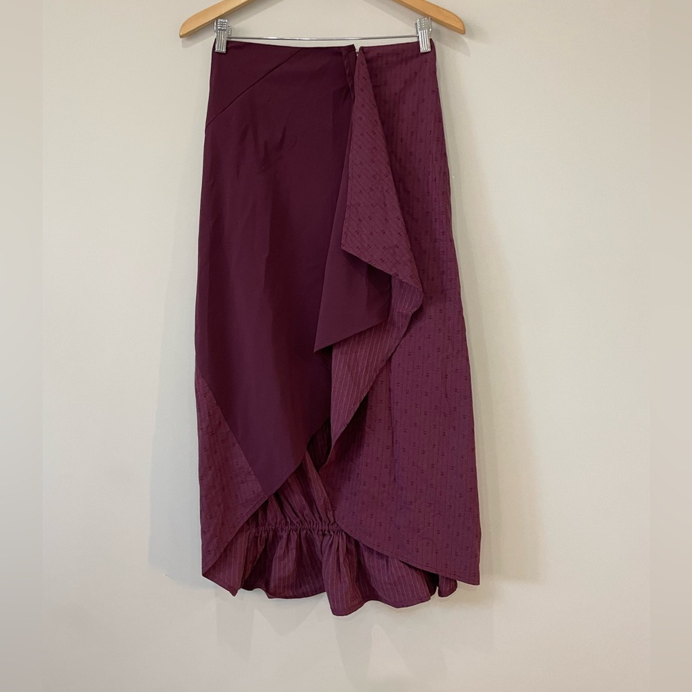 Solola burgundy asymmetrical synched hem zip up front mixed pattern maxi skirt